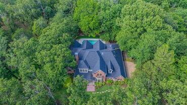 7451 County Road 1509 Athens, TX 75751 - Photo 34 of 36 an aerial view of a house with a yard and large trees