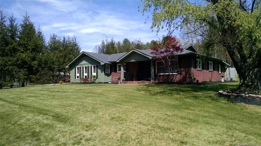 1978 Ridge Road Hendersonville, NC 28792 - Photo 13 of 18 a front view of a house with a garden