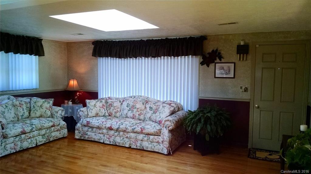 1978 Ridge Road Hendersonville, NC 28792 - Photo 3 of 18 a living room with furniture and a fireplace