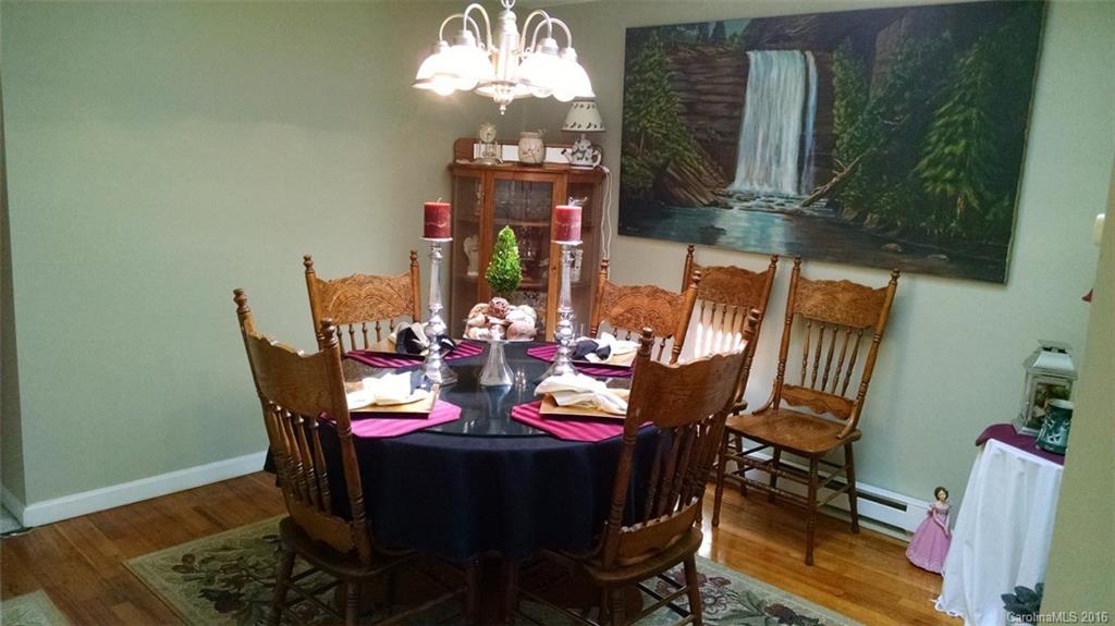 1978 Ridge Road Hendersonville, NC 28792 - Photo 5 of 18 a view of a dining room with furniture and chandelier
