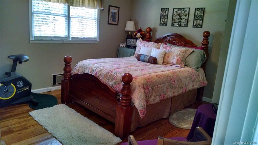 1978 Ridge Road Hendersonville, NC 28792 - Photo 8 of 18 a bedroom with a bed and a window