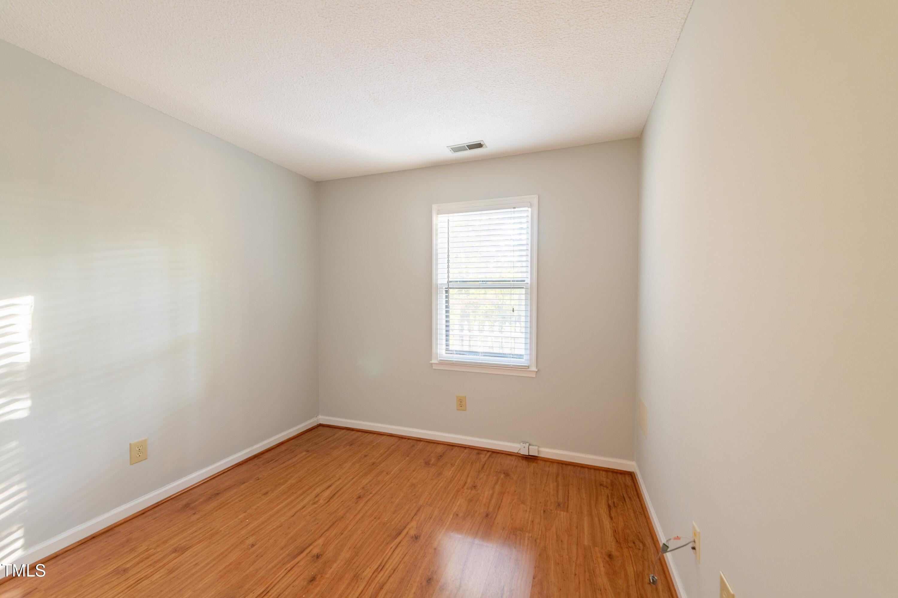 7910 Yester Court Raleigh, NC 27615 - Photo 12 of 24 First Bedroom