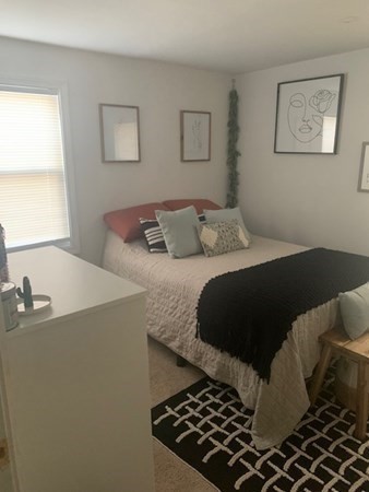 863 Roosevelt Avenue Springfield, MA 01109 - Photo 12 of 18 a bedroom with a bed and a window