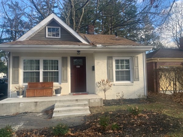 863 Roosevelt Avenue Springfield, MA 01109 - Photo 2 of 18 a front view of a house with a yard