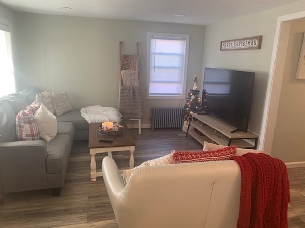 863 Roosevelt Avenue Springfield, MA 01109 - Photo 7 of 18 a bedroom with furniture and a flat screen tv