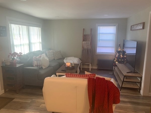 863 Roosevelt Avenue Springfield, MA 01109 - Photo 10 of 18 a bedroom with a bed and wooden floor
