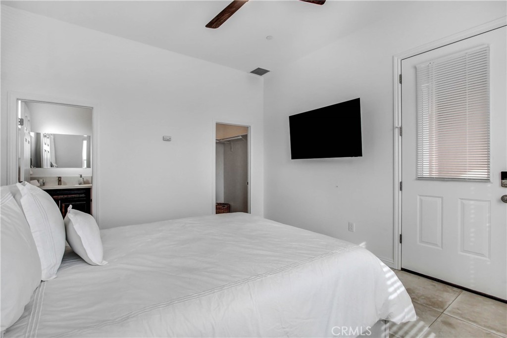66604 Estrella Avenue, Unit CASITA Desert Hot Springs, CA 92240 - Photo 2 of 6 a bedroom with a bed and a flat screen tv
