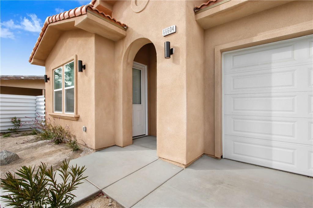 66604 Estrella Avenue, Unit CASITA Desert Hot Springs, CA 92240 - Photo 6 of 6 a view of a front door and a door