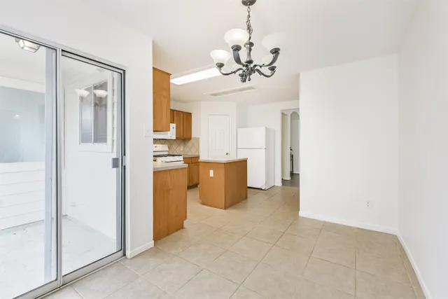 a view of a kitchen with a sink and cabinet