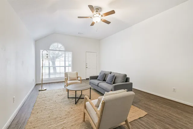 a living room with furniture and a window