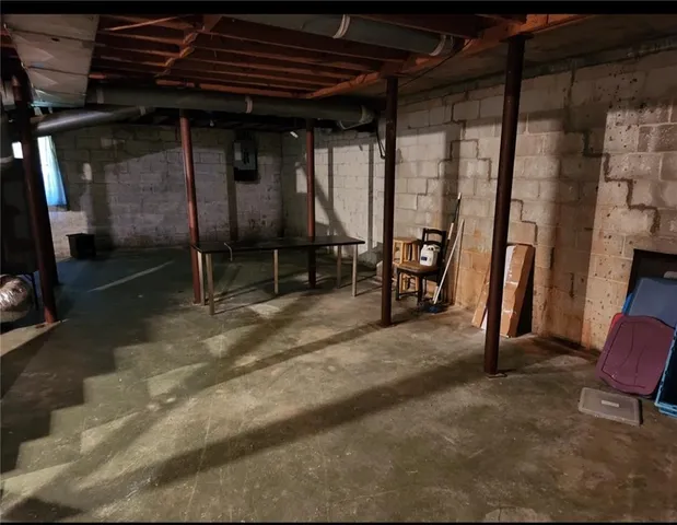 a view of an empty room with glass door