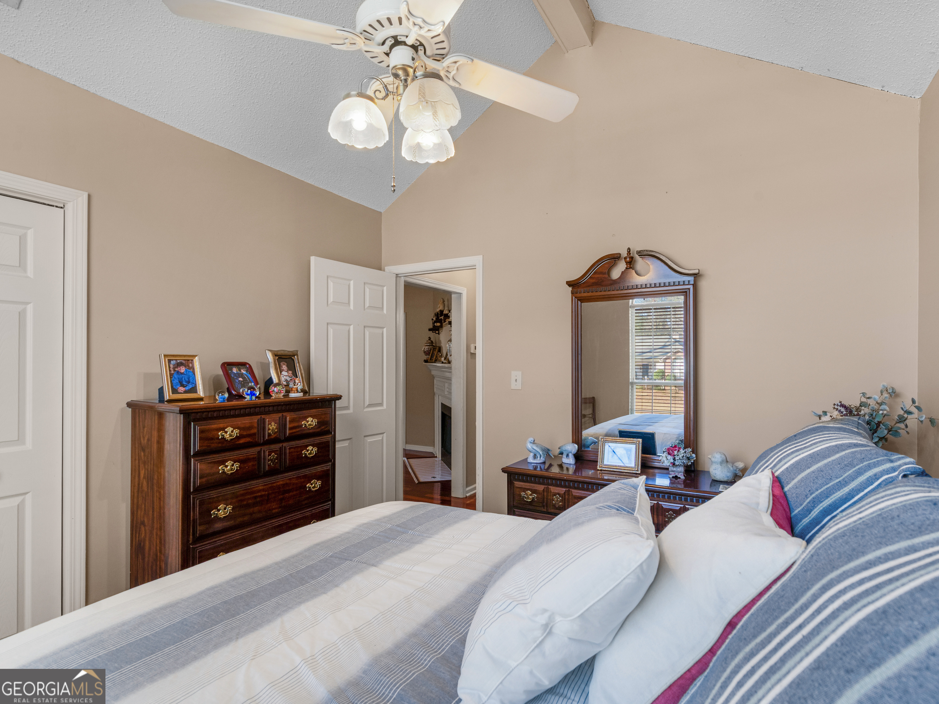 521 Horseshoe Circle Stockbridge, GA 30281 - Photo 22 of 54 a bedroom with a bed and wooden floor