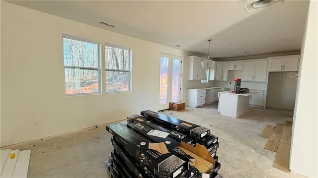 a kitchen with a stove and a refrigerator