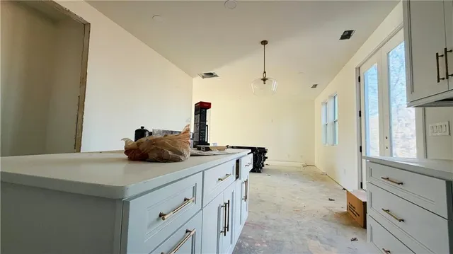 a kitchen with cabinets and white appliances