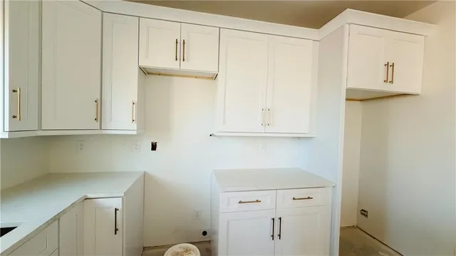 a view of cabinets and wooden floor