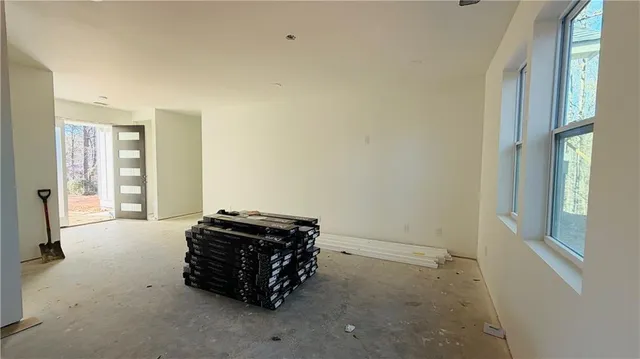 a room with a bed and a window