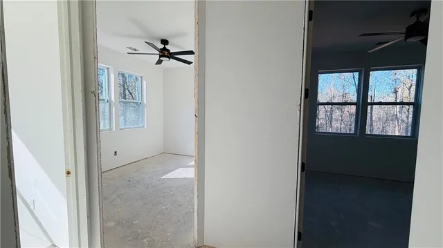 a view of an empty room with a window