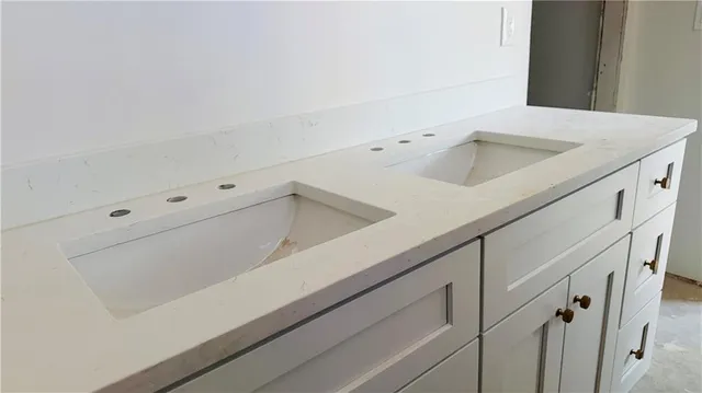 an empty room that has a window and a hallway