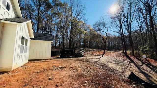 a view of a house with a snow in the yard