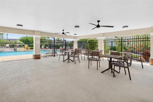 a view of a patio with a table and chairs