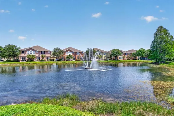 a view of a lake with houses in the back