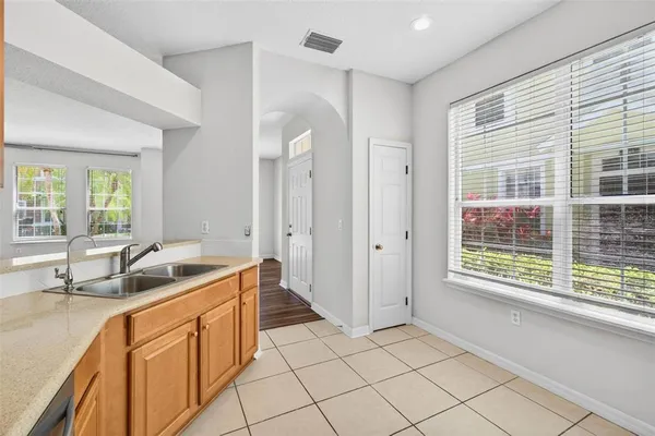 a kitchen that has a sink and a large window