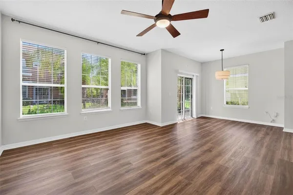a view of room window and wooden floor