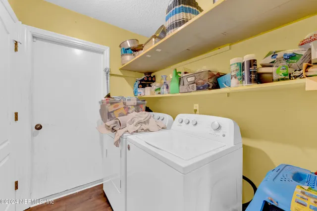 a utility room with dryer and washer