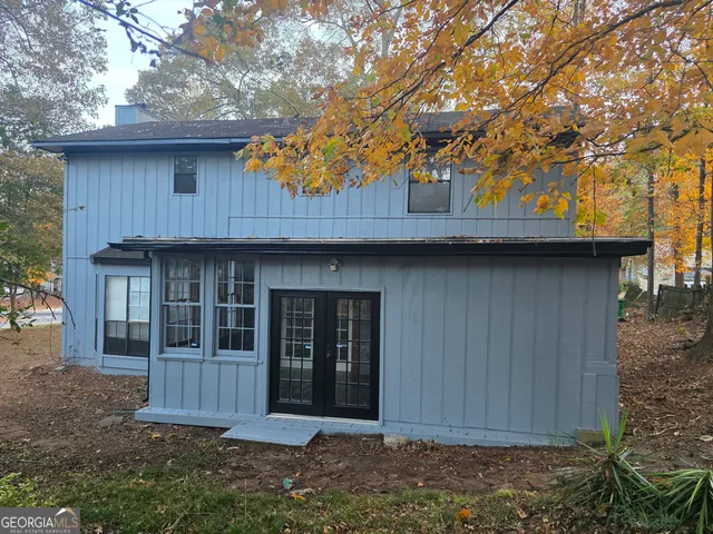 a house with trees in the background