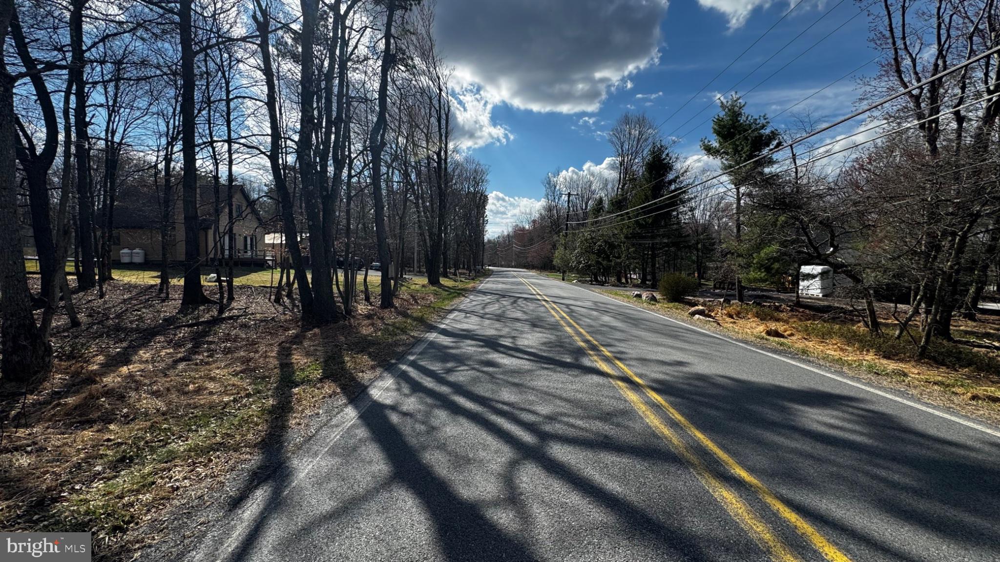 0 Stony Mountain Road Albrightsville, PA 18210 - Photo 17 of 24 Serene country road under blue skies.