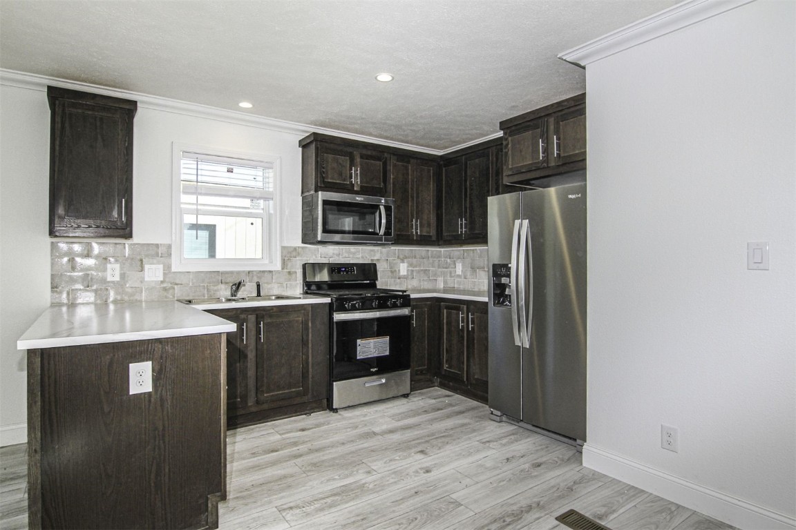 847 Airport Road, Unit 12 Breckenridge, CO 80424 - Photo 12 of 32 a kitchen with a refrigerator stove and sink