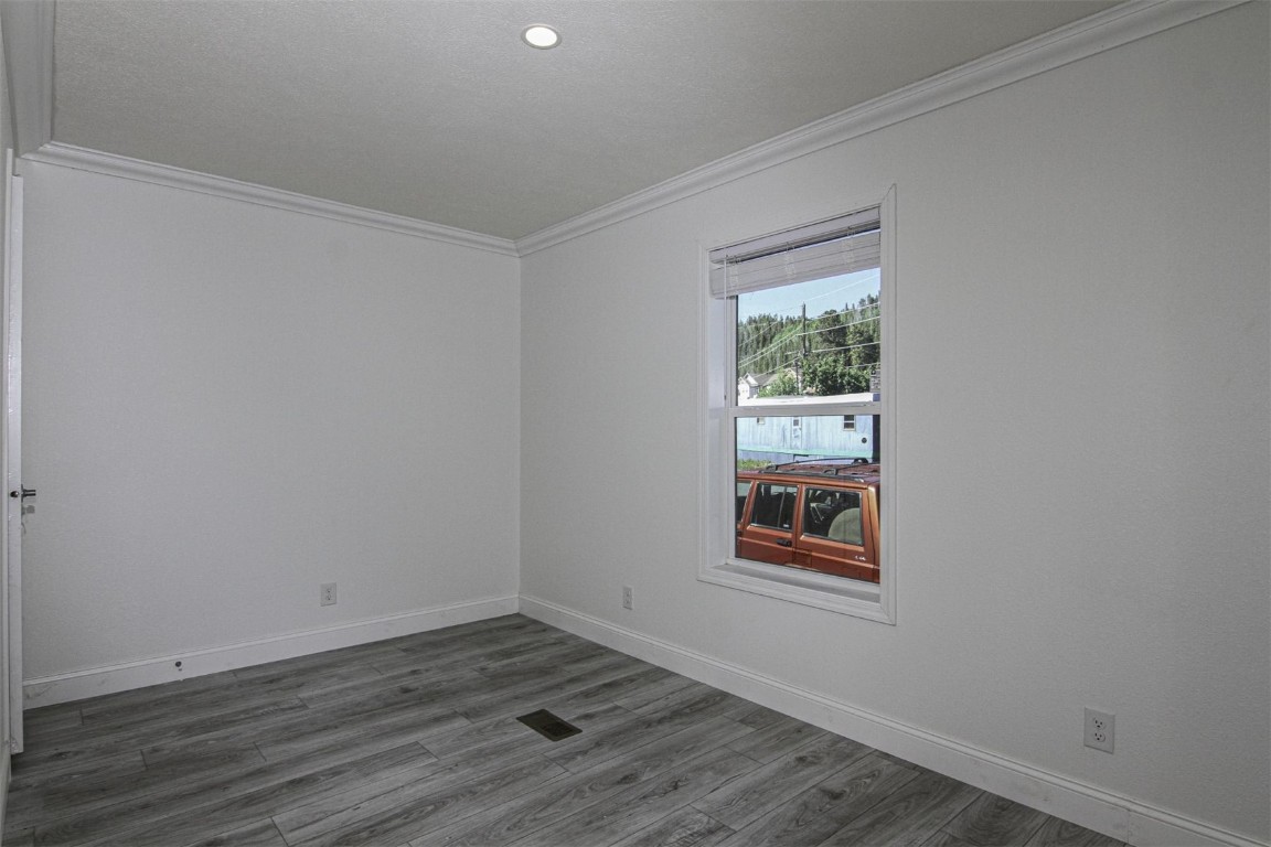 847 Airport Road, Unit 12 Breckenridge, CO 80424 - Photo 14 of 32 a view of an empty room with wooden floor and a window