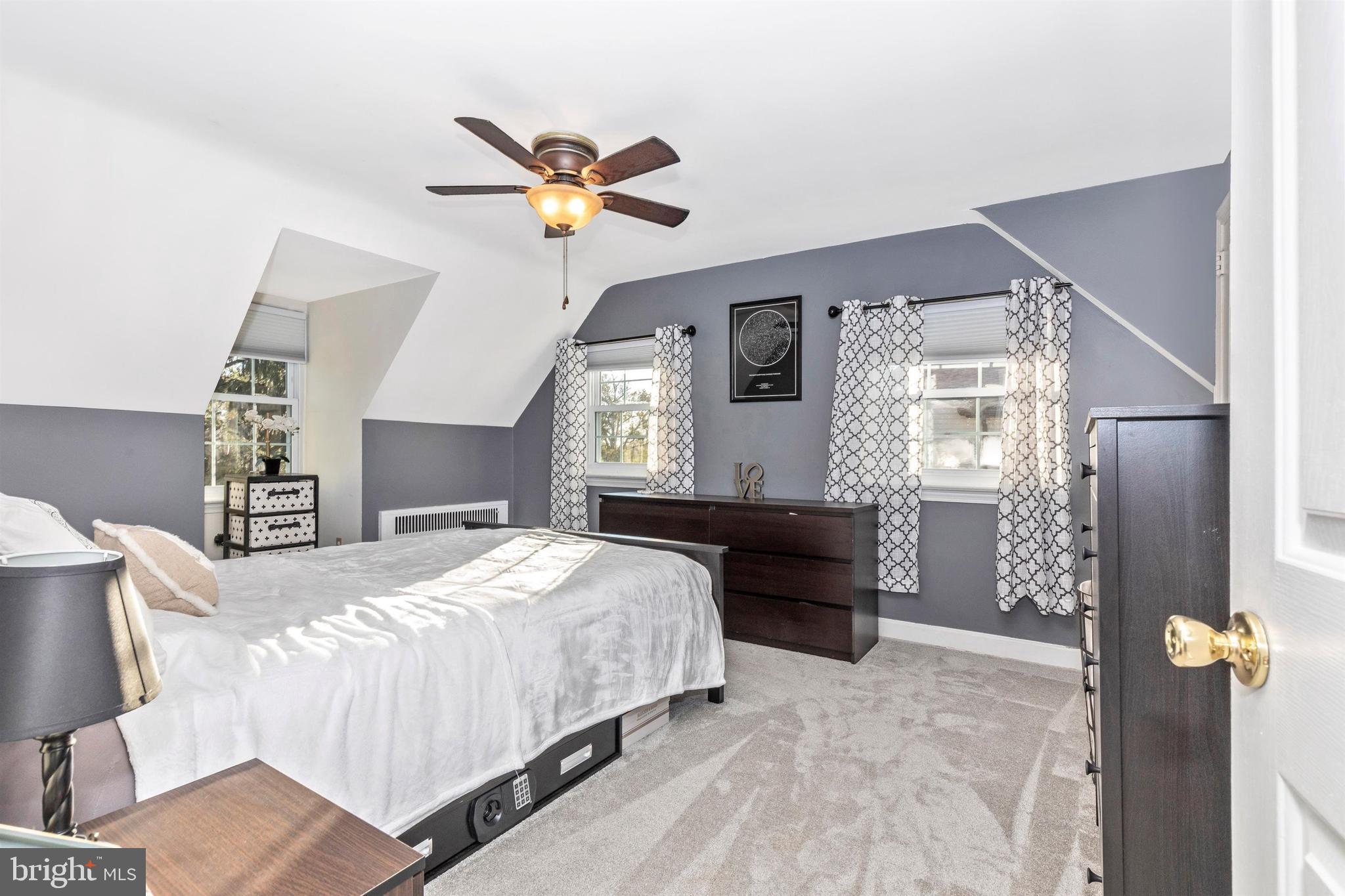 1432 Burmont Road Havertown, PA 19083 - Photo 14 of 28 a bedroom with a bed and a chandelier