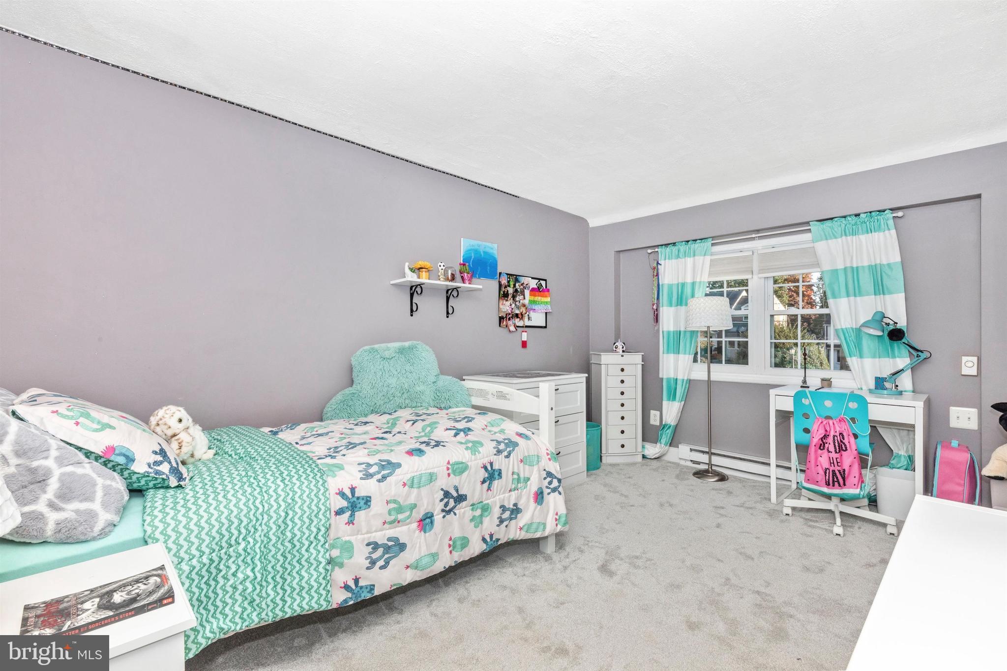 1432 Burmont Road Havertown, PA 19083 - Photo 19 of 28 a bedroom with two beds and a window