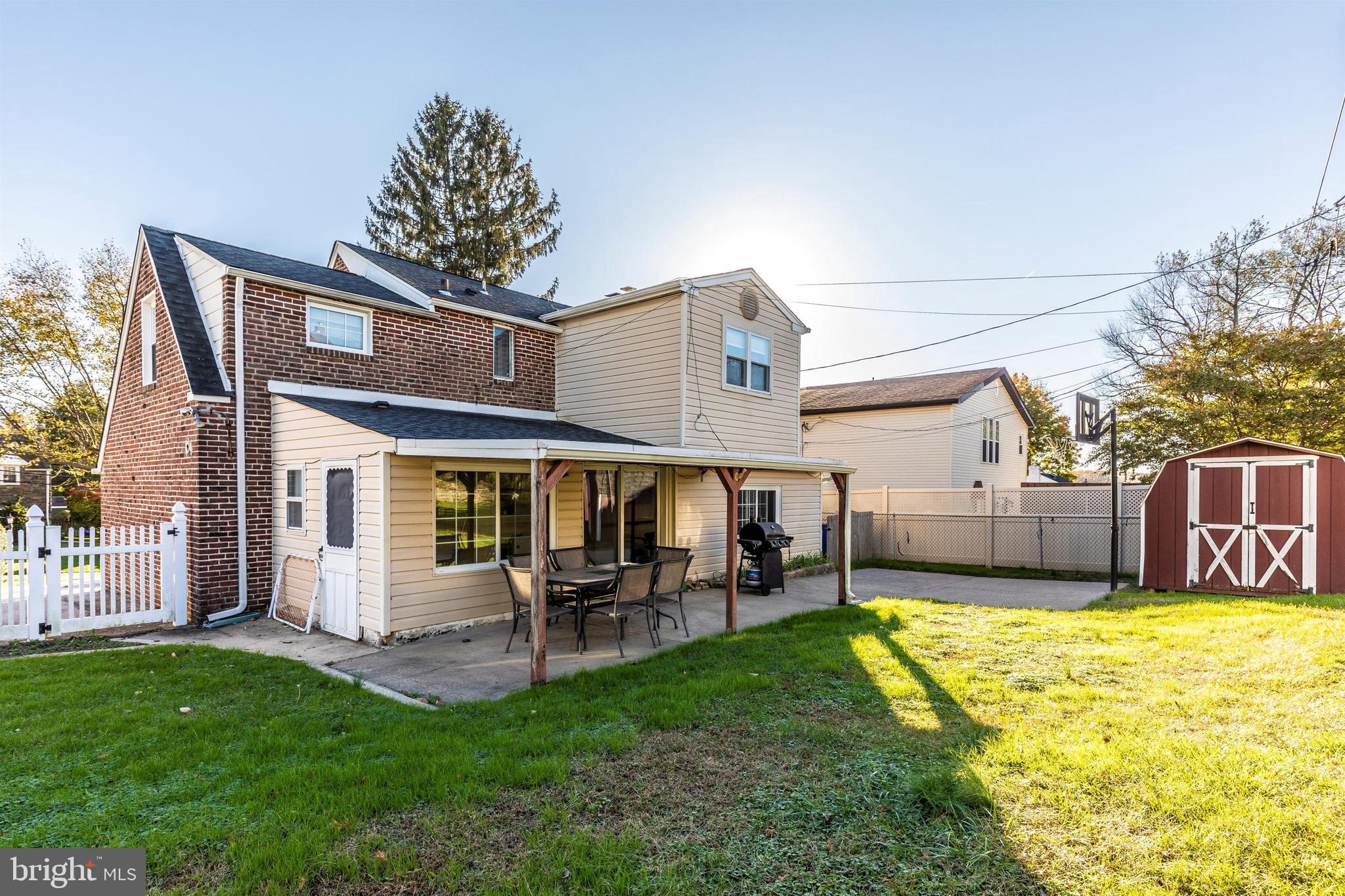 1432 Burmont Road Havertown, PA 19083 - Photo 27 of 28 a view of a house with a backyard porch and sitting area