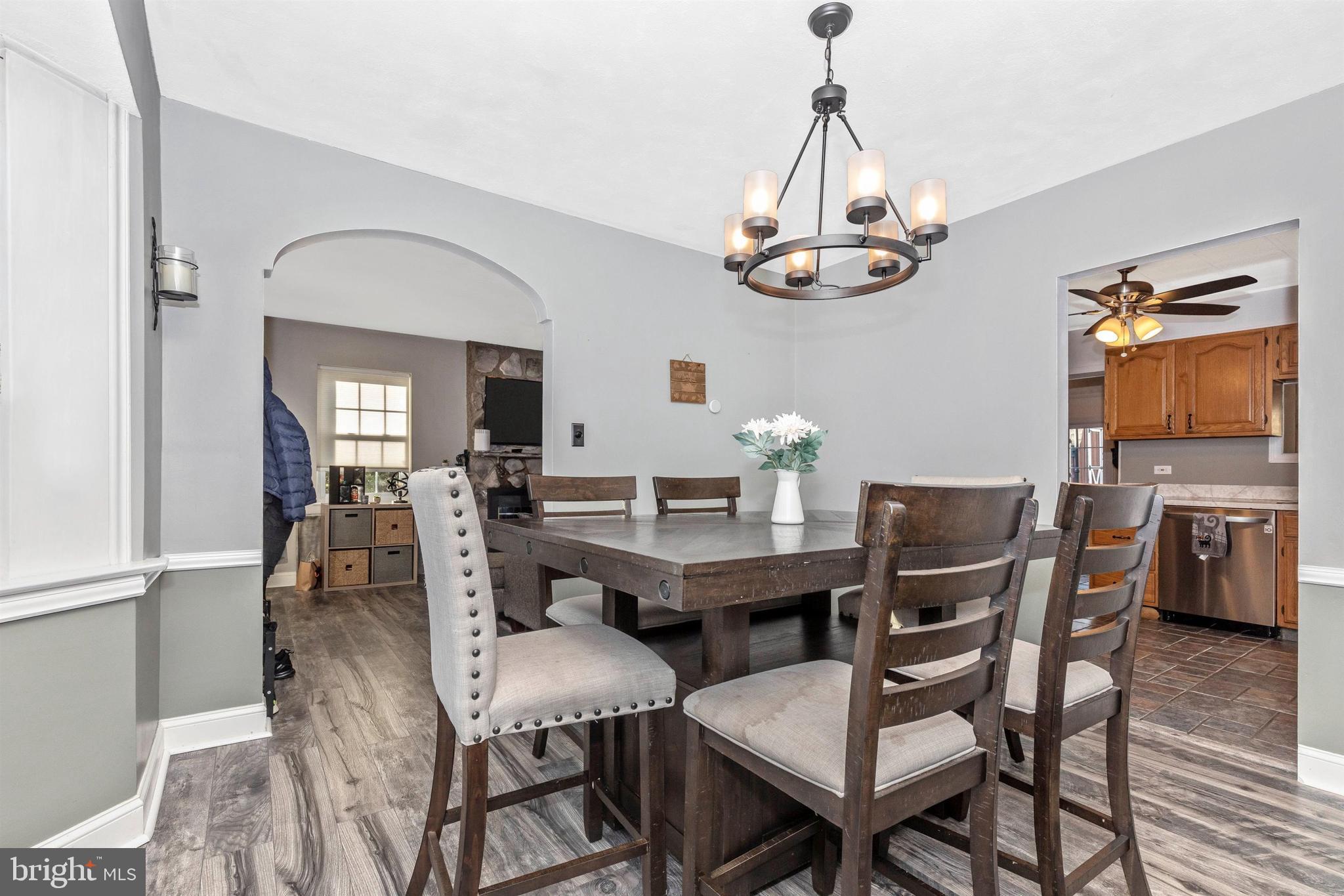 1432 Burmont Road Havertown, PA 19083 - Photo 6 of 28 a view of a dining room with furniture wooden floor and chandelier