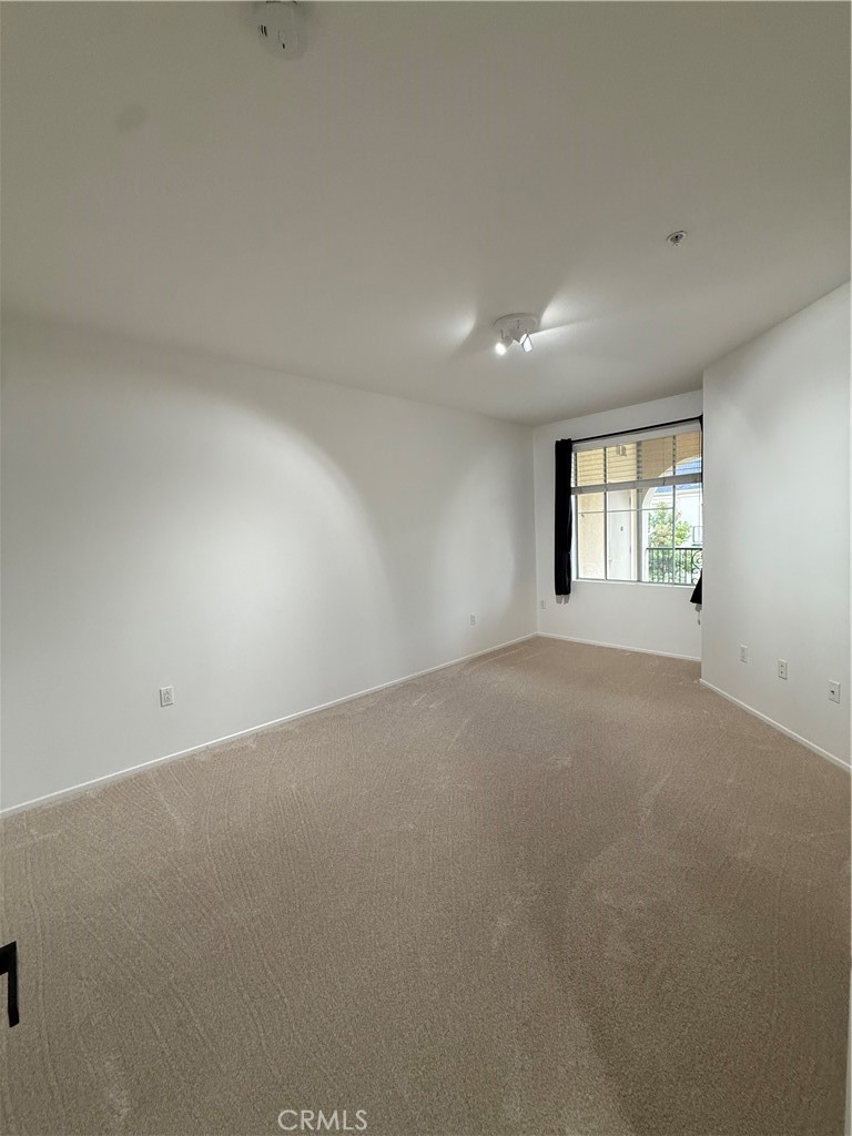 2457 Watermarke Place Irvine, CA 92612 - Photo 11 of 13 an empty room with windows