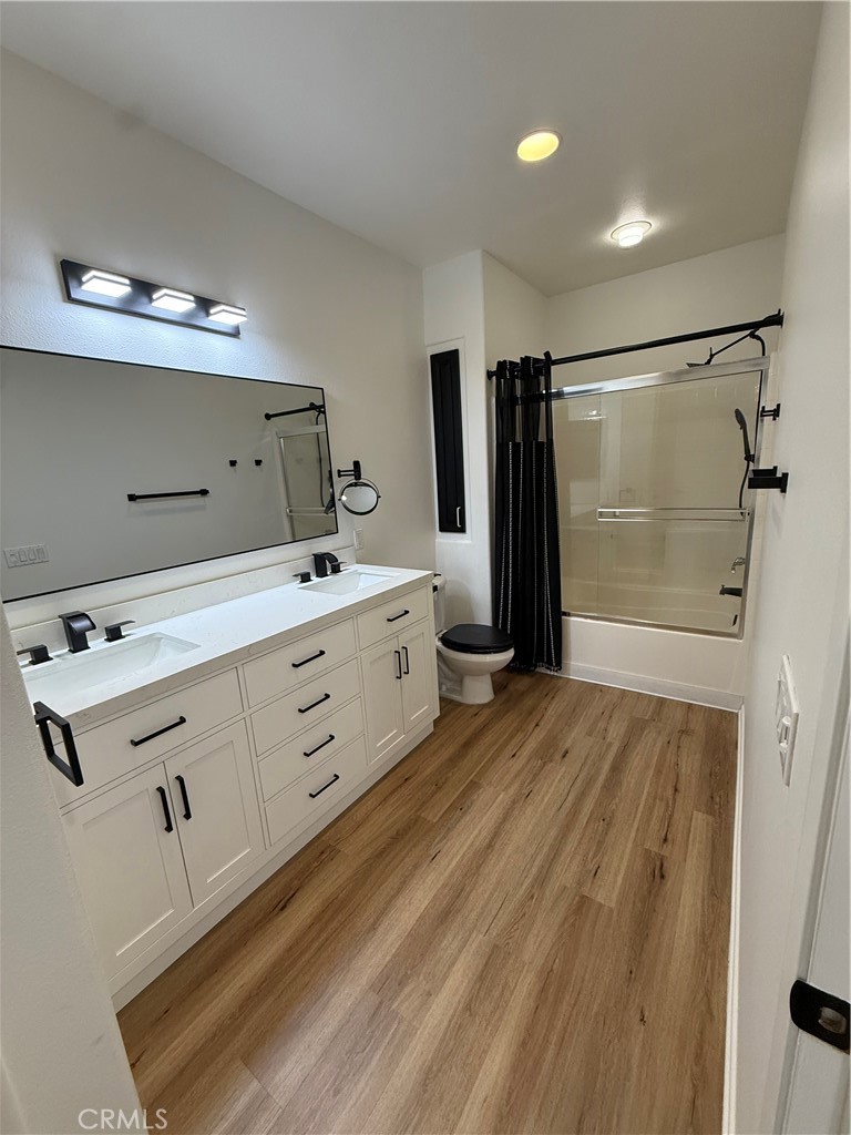 2457 Watermarke Place Irvine, CA 92612 - Photo 3 of 13 a kitchen with a refrigerator and a sink