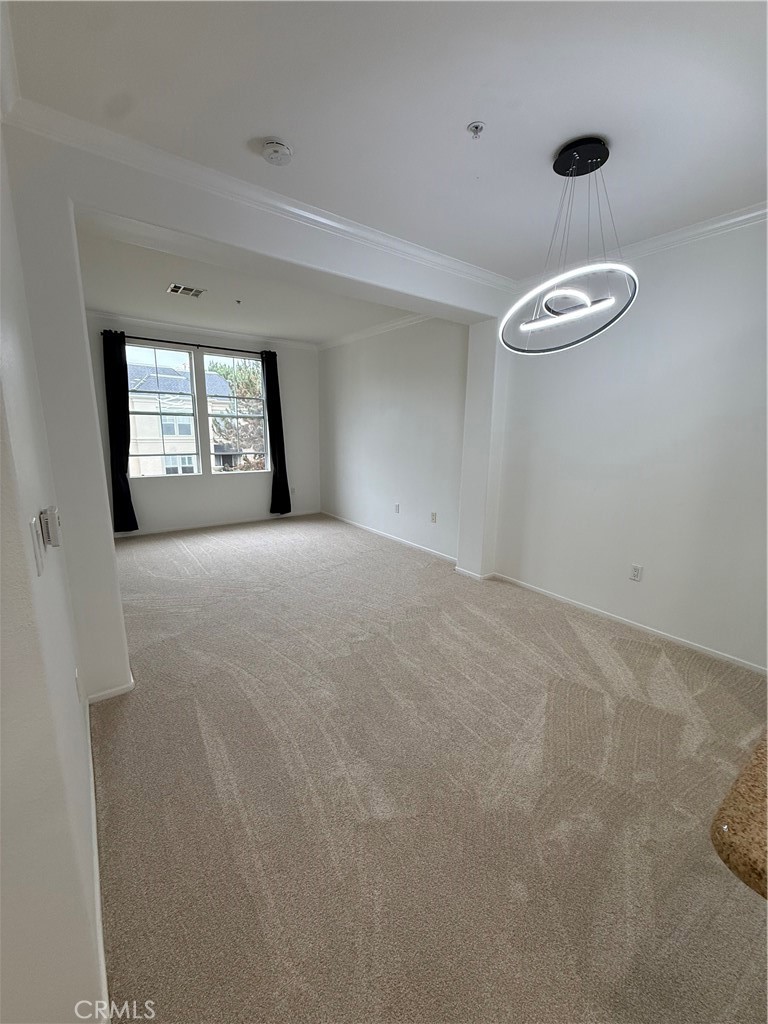 2457 Watermarke Place Irvine, CA 92612 - Photo 5 of 13 a view of a livingroom with a window and a ceiling fan