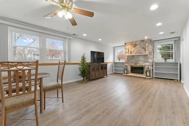 a living room with furniture and a kitchen view