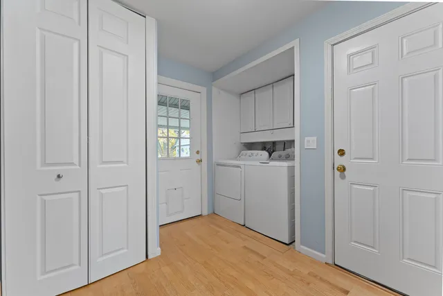 a view of a kitchen with closet and window