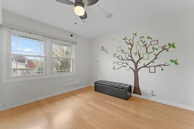 a view of room with window and ceiling fan