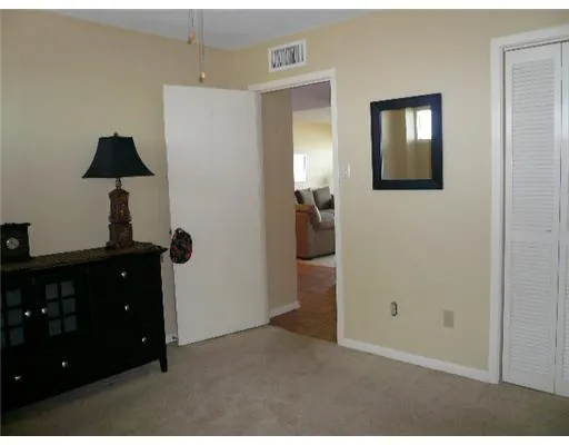 a living room with furniture and a bathroom