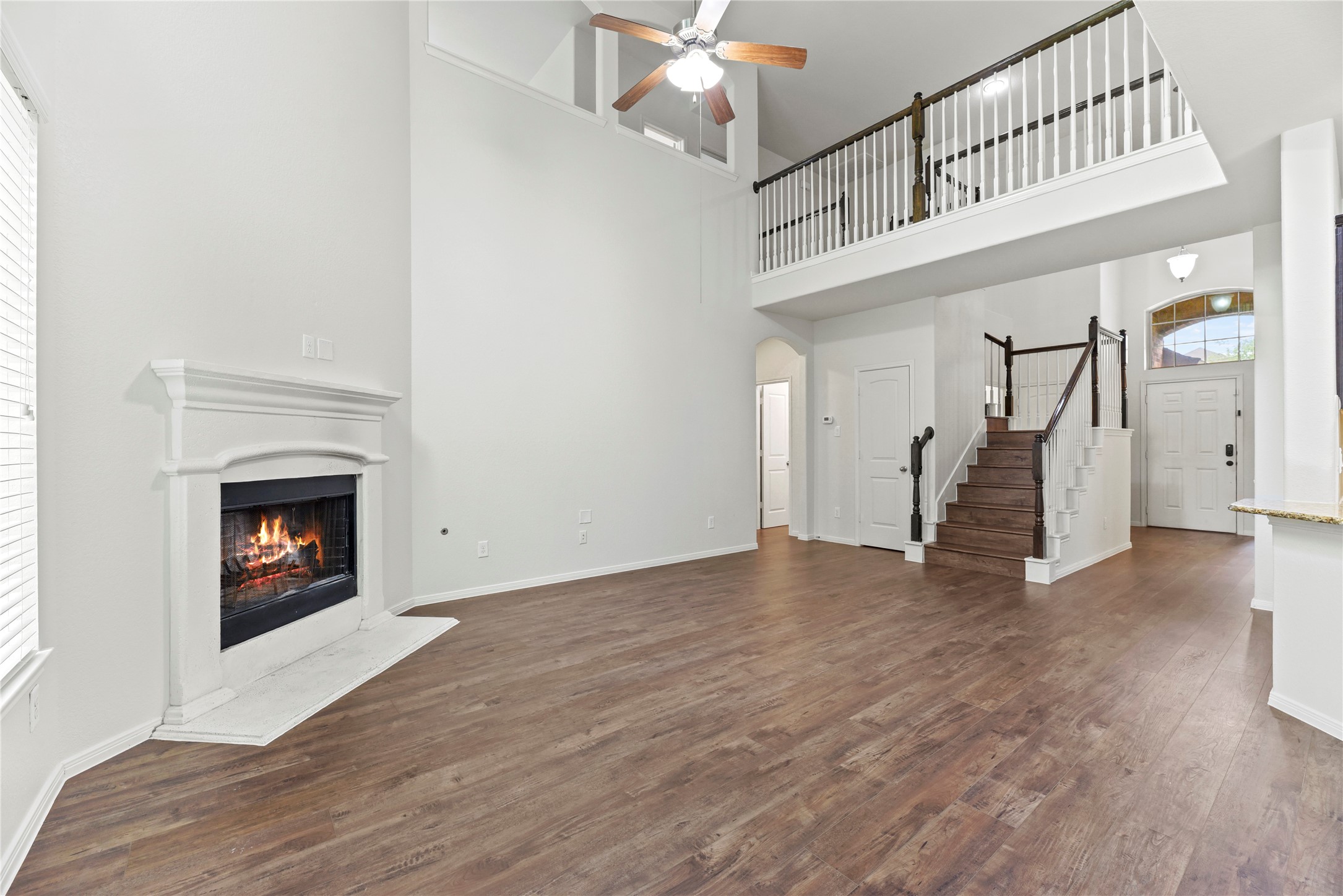 22514 Forbes Field Trail Spring, TX 77389 - Photo 16 of 37 a view of an empty room with wooden floor fireplace and a window