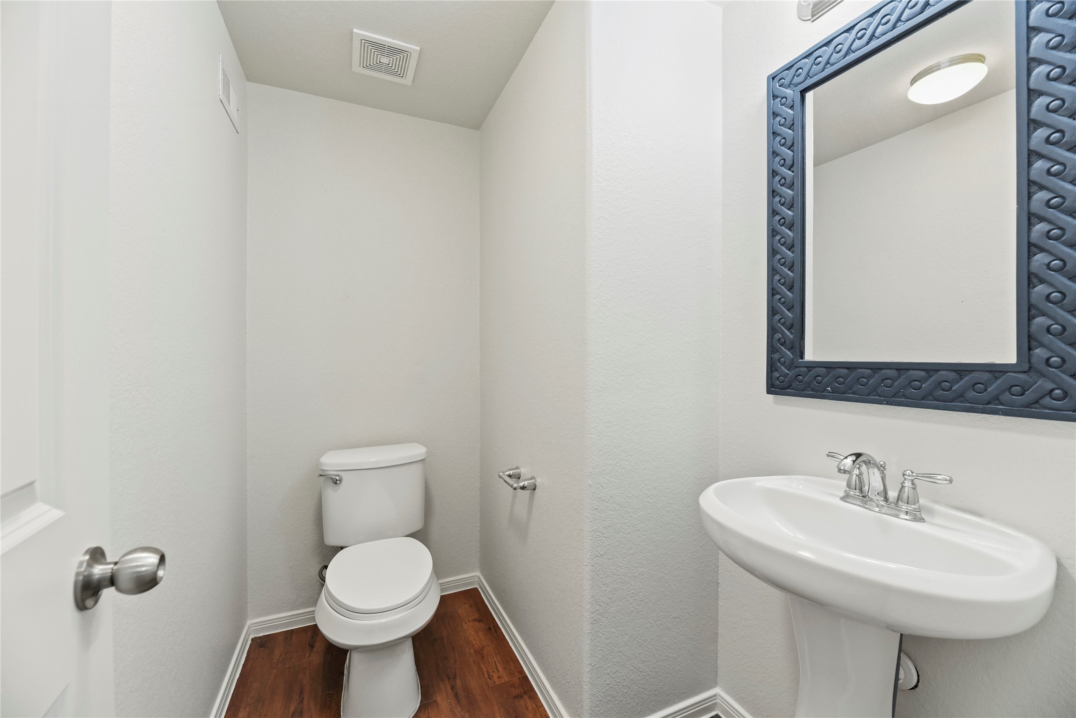 22514 Forbes Field Trail Spring, TX 77389 - Photo 18 of 37 a bathroom with a toilet sink and mirror