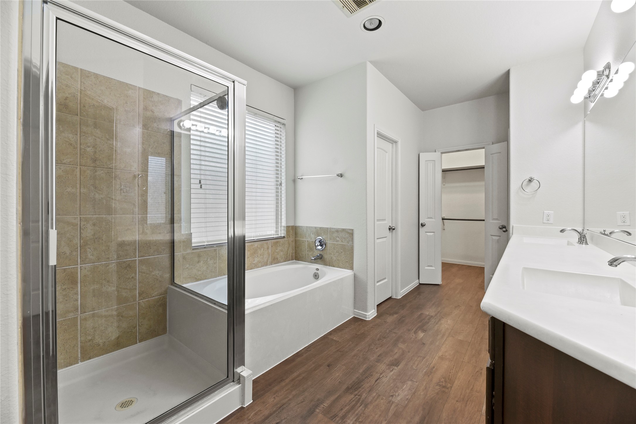 22514 Forbes Field Trail Spring, TX 77389 - Photo 20 of 37 a bathroom with a tub sink shower and mirror