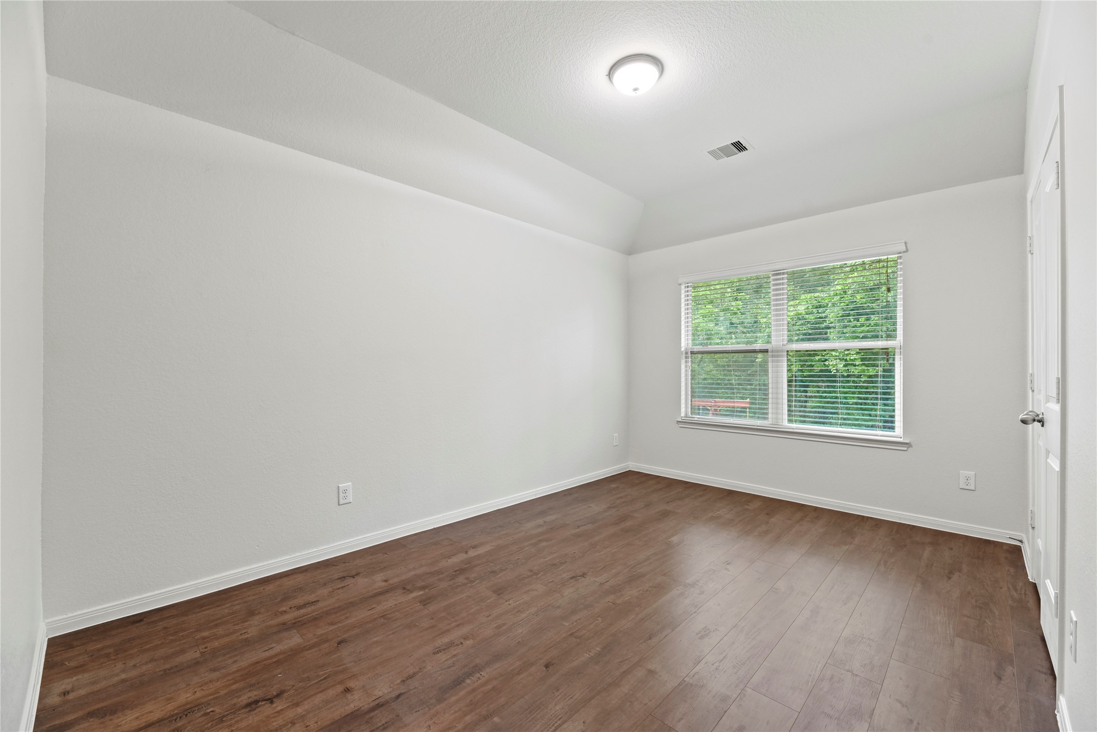 22514 Forbes Field Trail Spring, TX 77389 - Photo 26 of 37 an empty room with wooden floor and windows