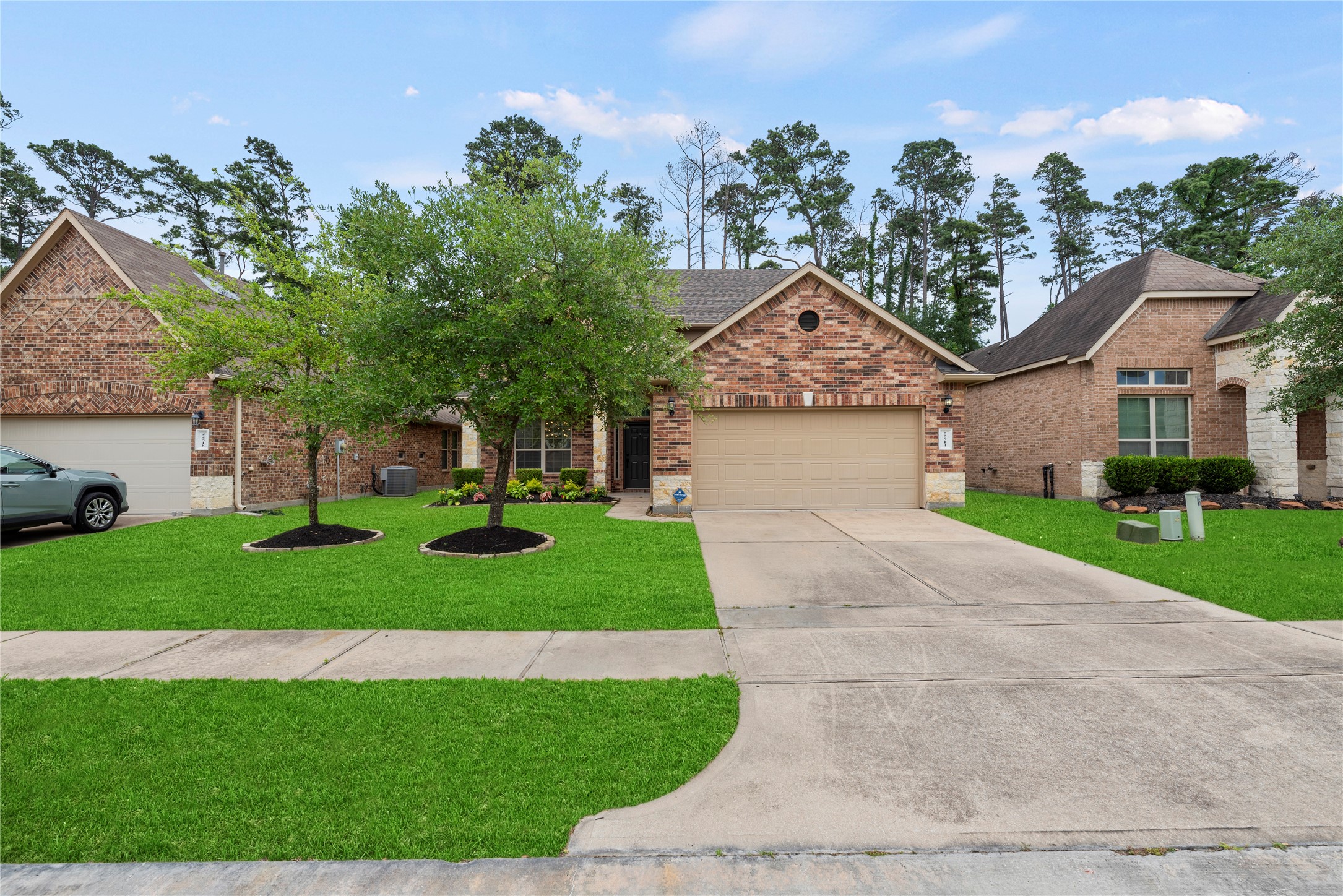 22514 Forbes Field Trail Spring, TX 77389 - Photo 35 of 37 a front view of a house with a yard and garage