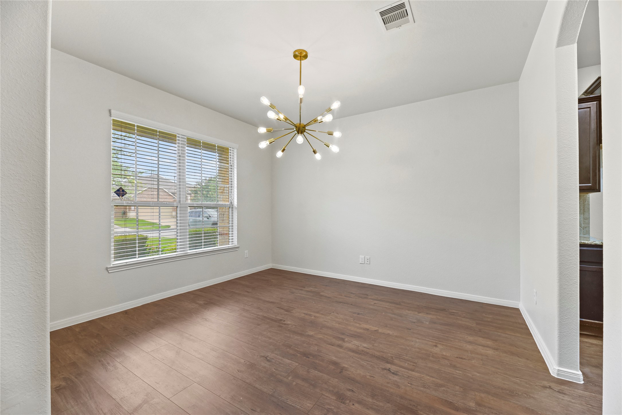 22514 Forbes Field Trail Spring, TX 77389 - Photo 5 of 37 a view of an empty room with wooden floor and a window
