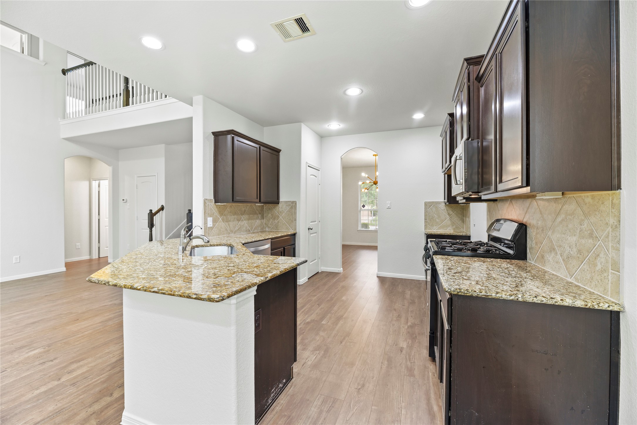 22514 Forbes Field Trail Spring, TX 77389 - Photo 9 of 37 a kitchen with a sink stove and refrigerator